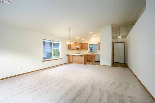 1301 E Sunset Dr, Newberg, OR 97132 - unfurnished living room with vaulted ceiling, light colored carpet, baseboards, a sink, and recessed lighting