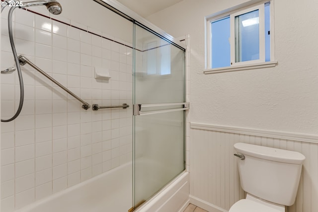 331 Limerick Ave, Eugene, OR 97404 - full bathroom featuring a wainscoted wall and combined bath / shower with glass door