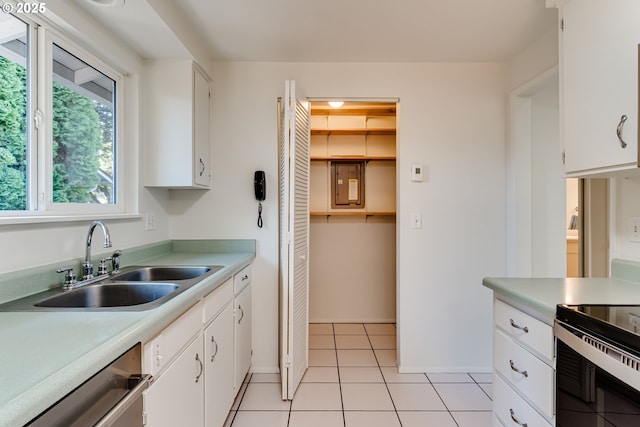 331 Limerick Ave, Eugene, OR 97404 - kitchen featuring stainless steel dishwasher, electric range, white cabinetry, and light countertops