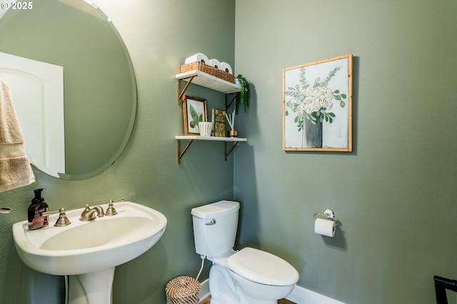 bathroom with sink and toilet