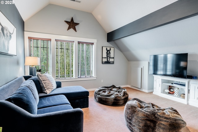 carpeted living room with vaulted ceiling