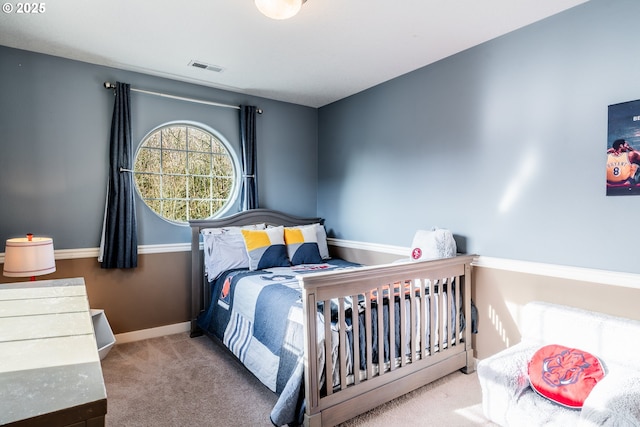 bedroom with light colored carpet