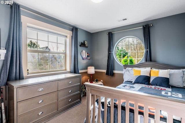 bedroom with light colored carpet