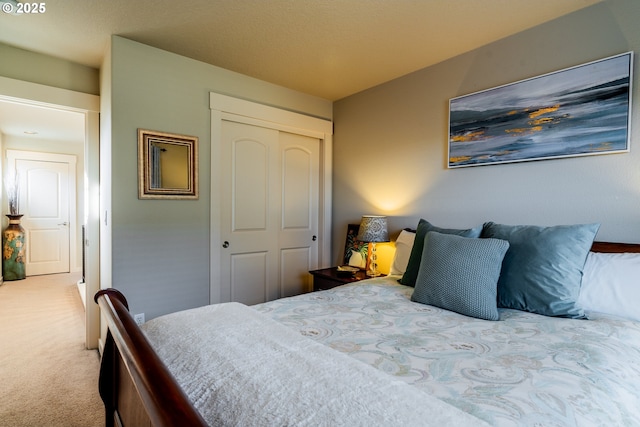 carpeted bedroom featuring a closet