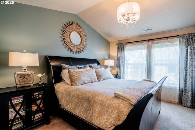 carpeted bedroom featuring lofted ceiling and a chandelier