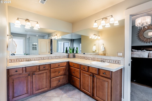 bathroom featuring tile patterned flooring, vanity, and decorative backsplash