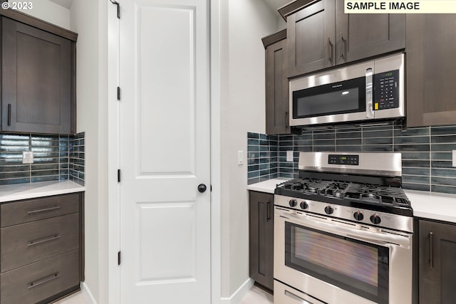 kitchen featuring stainless steel appliances, tasteful backsplash, light countertops, and dark brown cabinetry