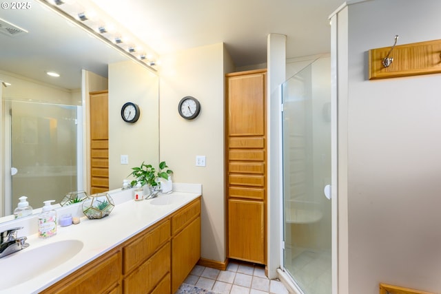 bathroom with vanity, tile patterned floors, and walk in shower