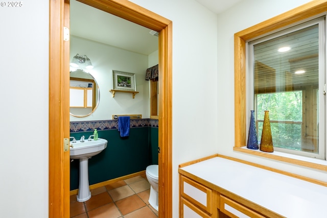 bathroom featuring tile patterned floors and toilet