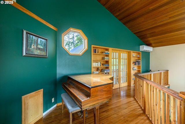 miscellaneous room featuring french doors, vaulted ceiling, wooden ceiling, an AC wall unit, and hardwood / wood-style flooring