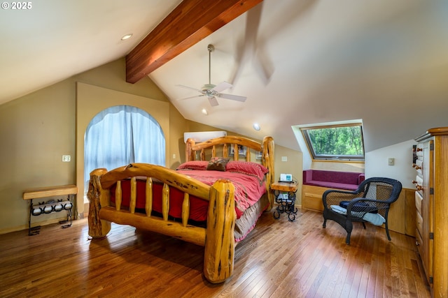 bedroom featuring lofted ceiling with beams, hardwood / wood-style flooring, and ceiling fan