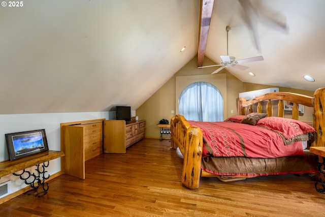 bedroom with vaulted ceiling with beams, ceiling fan, and light hardwood / wood-style flooring