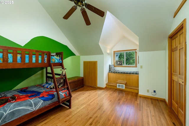 bedroom featuring vaulted ceiling, ceiling fan, and light wood-type flooring