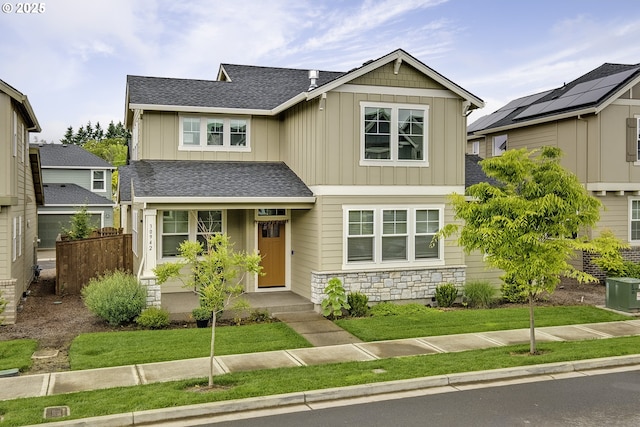 30942 NW Turel Dr, North Plains, OR 97133 - craftsman inspired home featuring board and batten siding, a shingled roof, and stone siding