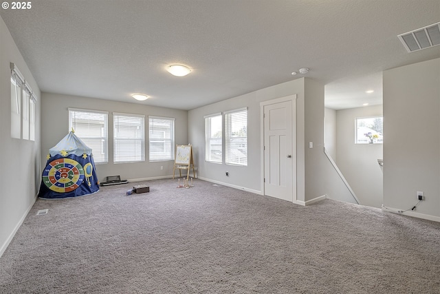 30942 NW Turel Dr, North Plains, OR 97133 - recreation room with baseboards, carpet flooring, and a textured ceiling