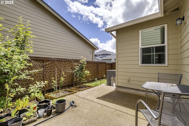30942 NW Turel Dr, North Plains, OR 97133 - view of patio with a vegetable garden and central air condition unit