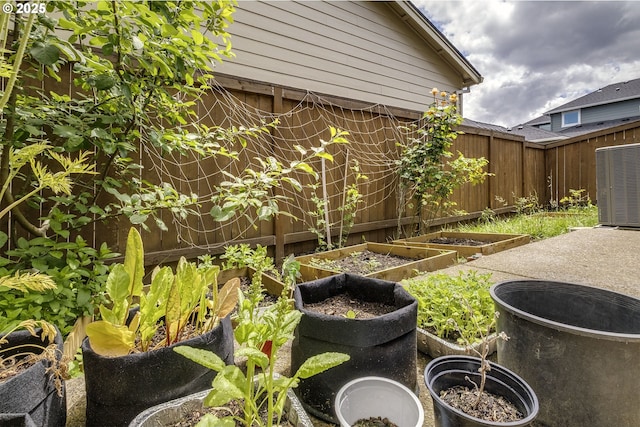 30942 NW Turel Dr, North Plains, OR 97133 - view of yard featuring a vegetable garden and central air condition unit