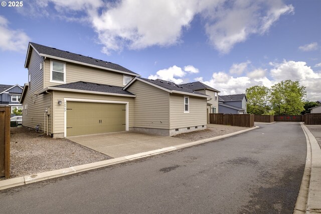 30942 NW Turel Dr, North Plains, OR 97133 - view of front of home featuring concrete driveway, a garage, and roof with shingles