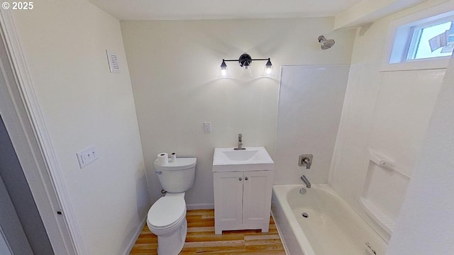 full bathroom with shower / washtub combination, visible vents, toilet, vanity, and wood finished floors