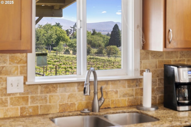5073 Chenoweth Rd, The Dalles, OR 97058 - kitchen with a sink, a mountain view, tasteful backsplash, and light stone countertops