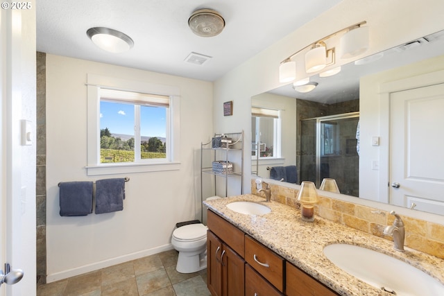 5073 Chenoweth Rd, The Dalles, OR 97058 - full bath featuring a shower stall, baseboards, double vanity, and toilet