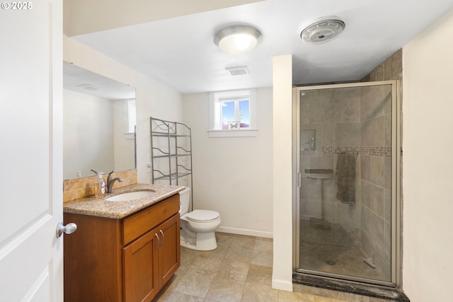 5073 Chenoweth Rd, The Dalles, OR 97058 - bathroom with vanity, a stall shower, toilet, and baseboards