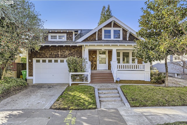 craftsman-style home with a garage, a front yard, and a porch