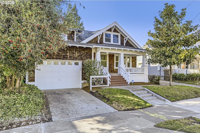 view of front of property featuring a porch and a garage