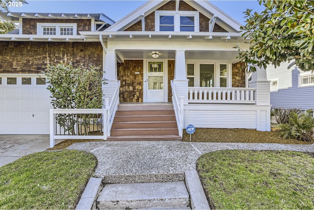 craftsman-style house featuring a garage and a porch