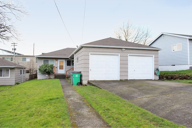 view of front of property with a garage, a front lawn, and a shingled roof