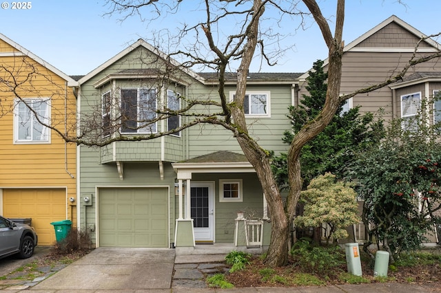 townhome / multi-family property featuring an attached garage and driveway