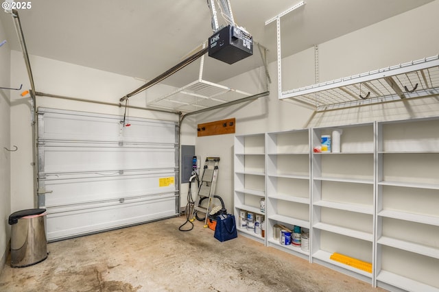 garage featuring a garage door opener and electric panel