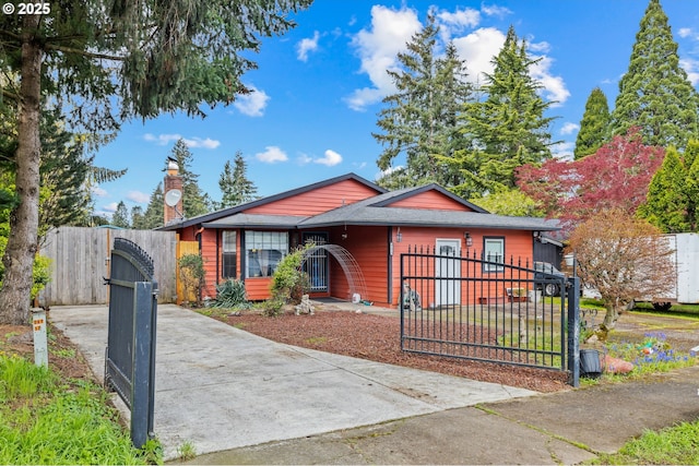 bungalow with a gate and a fenced front yard