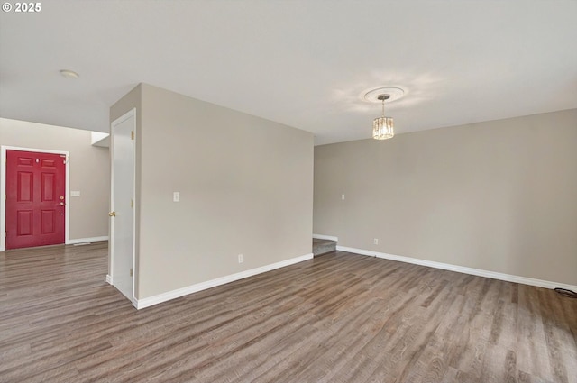 110 Wilshire Way, Kelso, WA 98626 - empty room featuring wood finished floors, baseboards, and a smoke detector