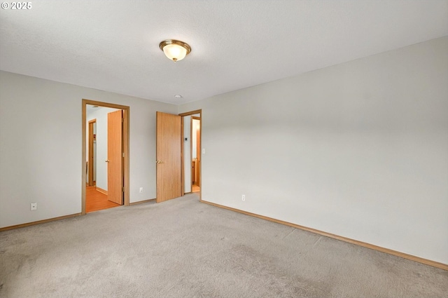 110 Wilshire Way, Kelso, WA 98626 - unfurnished bedroom with light colored carpet, baseboards, and ensuite bath