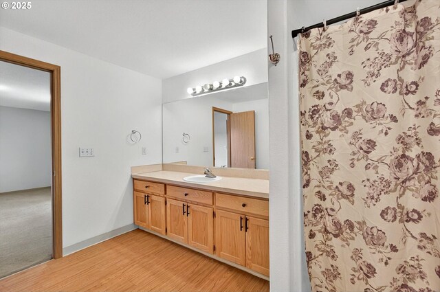 110 Wilshire Way, Kelso, WA 98626 - bathroom featuring wood finished floors, vanity, and a shower with curtain