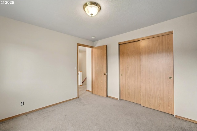 110 Wilshire Way, Kelso, WA 98626 - unfurnished bedroom featuring light carpet, baseboards, and a closet