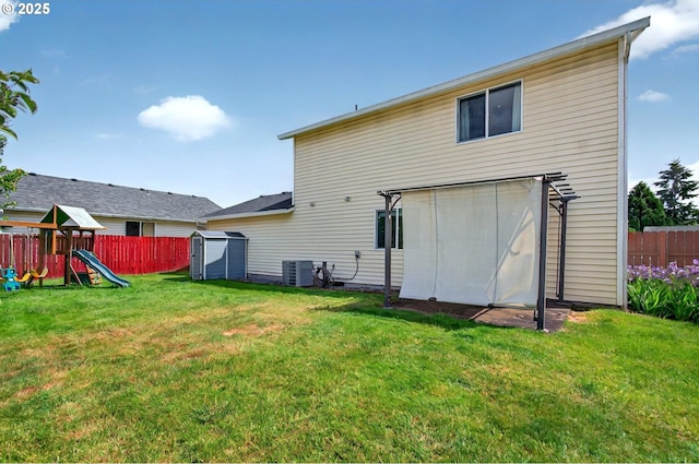 110 Wilshire Way, Kelso, WA 98626 - rear view of house featuring a storage shed, a playground, an outdoor structure, and cooling unit