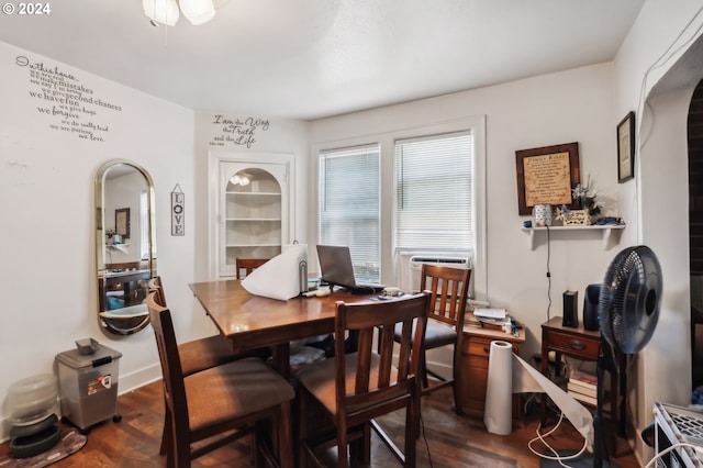 dining space with cooling unit and dark hardwood / wood-style flooring