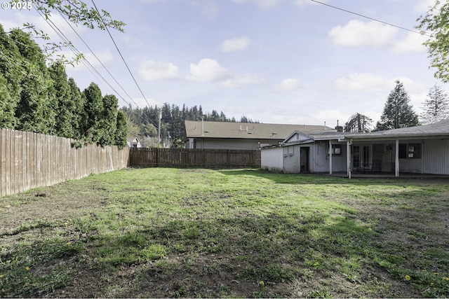 view of yard with a patio and a fenced backyard