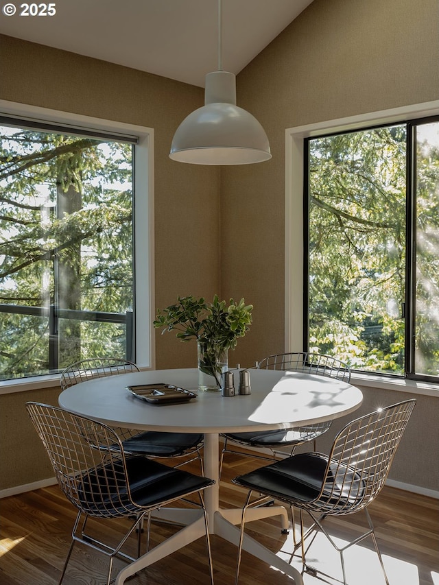 3342 SW Fairmount Blvd, Portland, OR 97239 - dining room with vaulted ceiling, wood finished floors, and baseboards