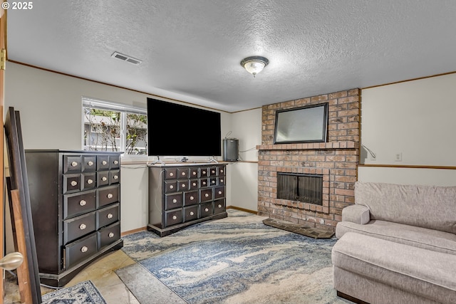 living area featuring a textured ceiling, a fireplace, visible vents, and baseboards