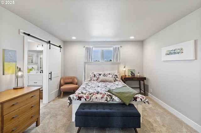 3588 Nestucca Loop, Eugene, OR 97408 - bedroom with a barn door, light carpet, ensuite bathroom, and recessed lighting