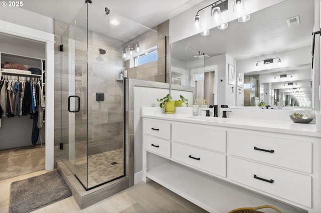 3588 Nestucca Loop, Eugene, OR 97408 - bathroom featuring vanity, a stall shower, and a spacious closet
