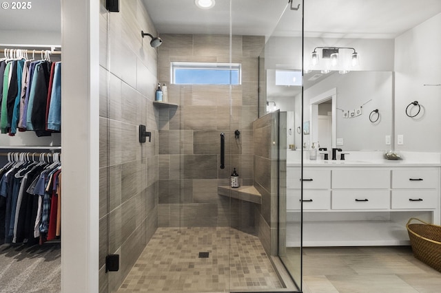 3588 Nestucca Loop, Eugene, OR 97408 - bathroom with vanity, a spacious closet, and a stall shower
