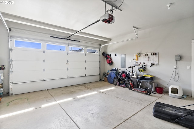 3588 Nestucca Loop, Eugene, OR 97408 - garage featuring a garage door opener and electric panel