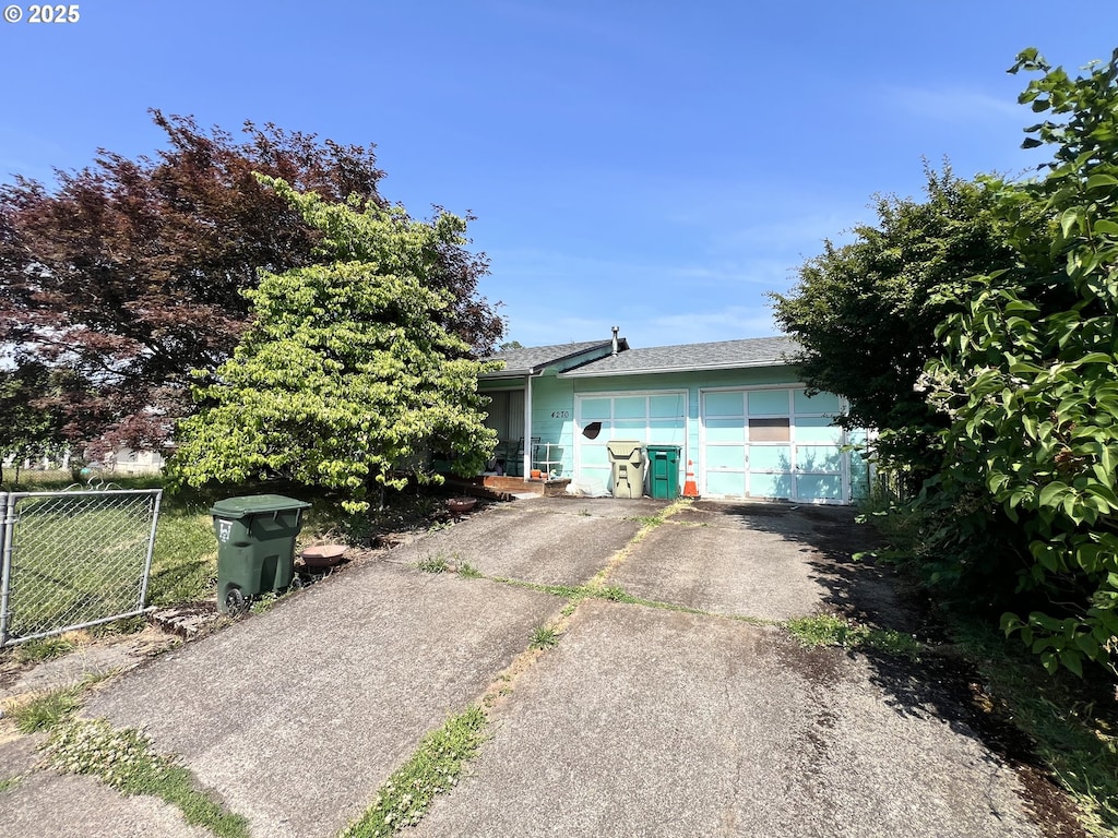 4270 SW 177th Ave, Beaverton, OR 97078 - view of property exterior featuring driveway, a garage, and roof with shingles