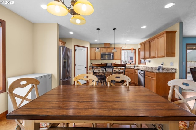 dining space with recessed lighting