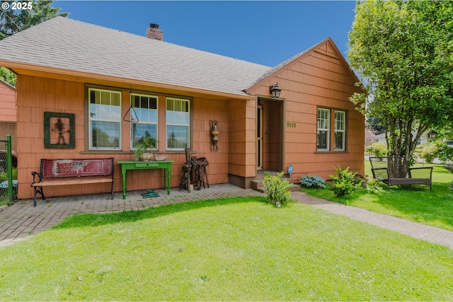 2112 Salem Ave, Albany, OR 97321 - view of front of house featuring a chimney, a front lawn, and a shingled roof