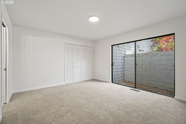 570 N Hayden Bay Dr, Portland, OR 97217 - unfurnished bedroom with carpet floors, baseboards, and a closet